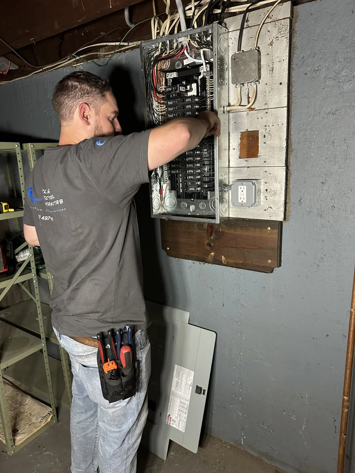 Atlantic Electrical Contractors, working on a residential electrical panel.